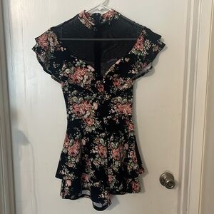 A’gaci 
High neck floral romper
Size: small